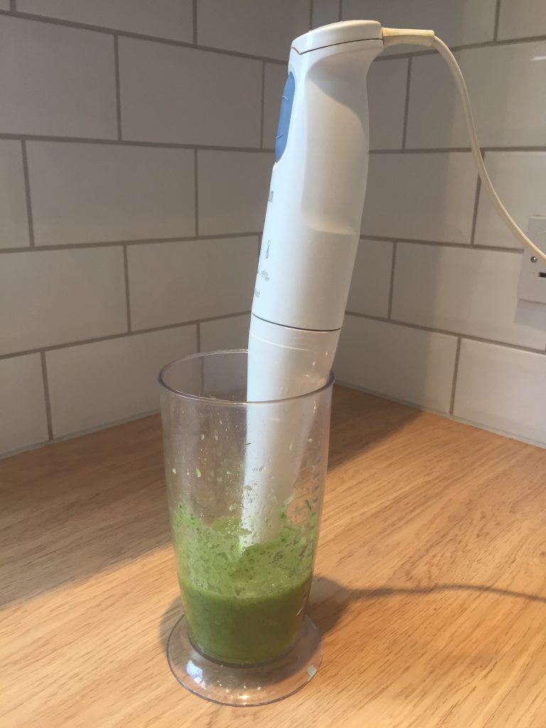 Making a facial cleanser by blitzing houseleek, rosewater and safflower oil.